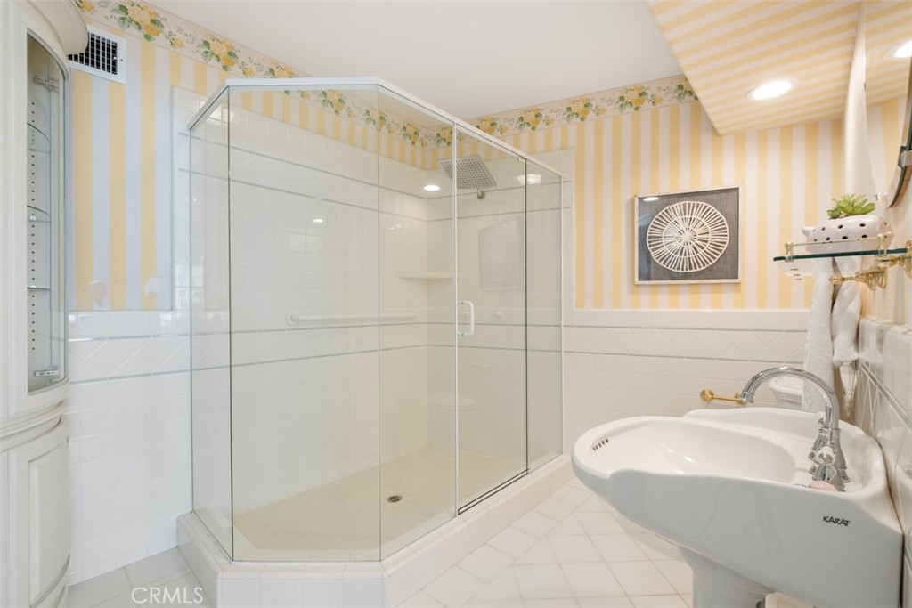 1201 Emerald Bay Laguna Beach, CA 92651 - Photo 40 of 47 a bathroom with a shower and a sink