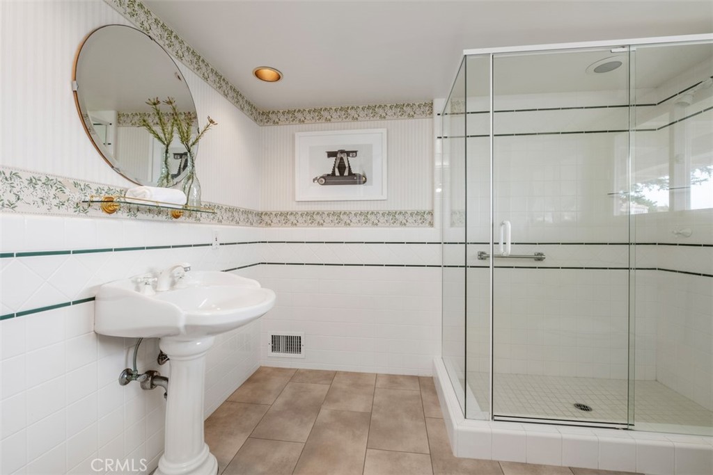 1201 Emerald Bay Laguna Beach, CA 92651 - Photo 44 of 47 a bathroom with a sink mirror and toilet