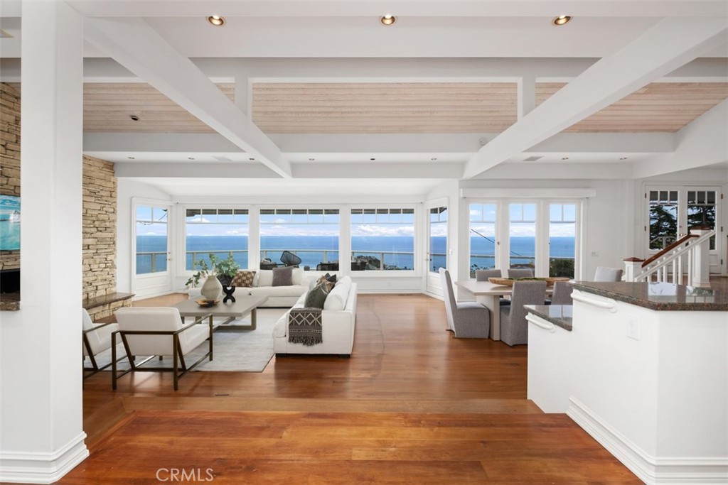 1201 Emerald Bay Laguna Beach, CA 92651 - Photo 8 of 47 a living room with fireplace furniture and a large window