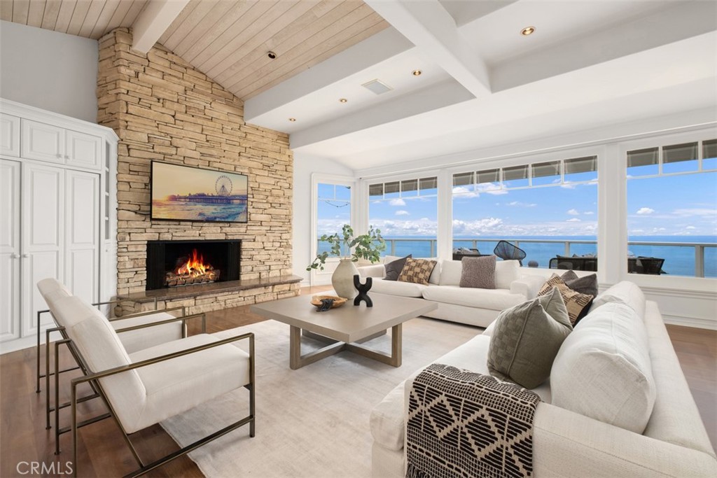 1201 Emerald Bay Laguna Beach, CA 92651 - Photo 9 of 47 a living room with furniture windows and a fireplace