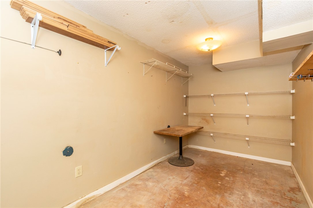 1302 Leeward Road Anderson, SC 29625 - Photo 30 of 50 A utilitarian storage area provides practical shelving and workspace for organizational needs.