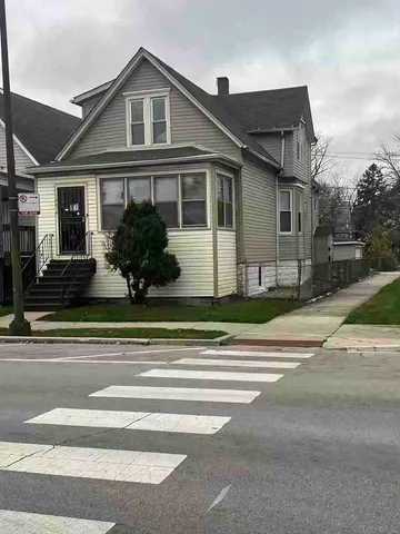 a view of a house and a yard