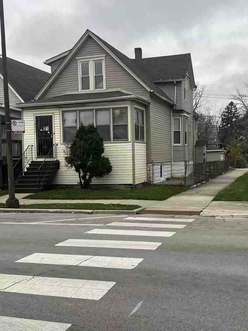 a view of a house and a yard
