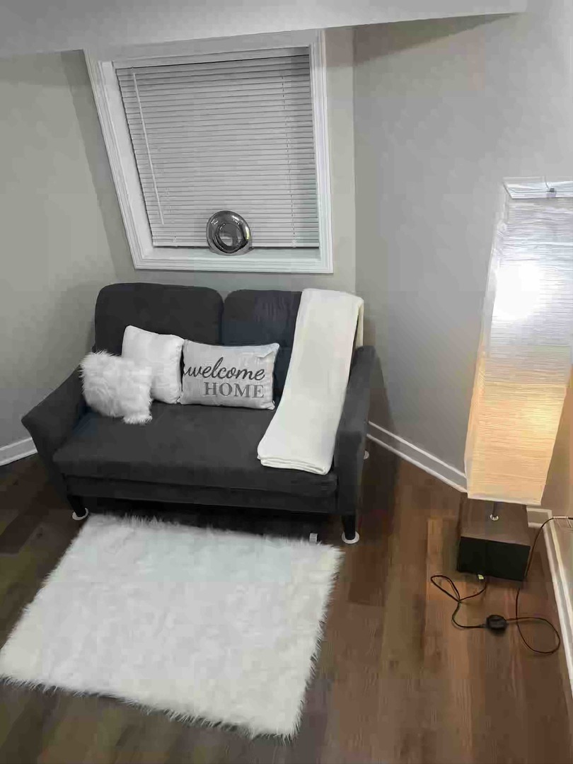 10434 South Wentworth Avenue, Unit GARDEN Chicago, IL 60628 - Photo 2 of 14 a living room with furniture