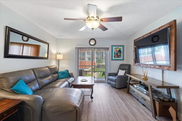 a room with furniture a rug and a chandelier