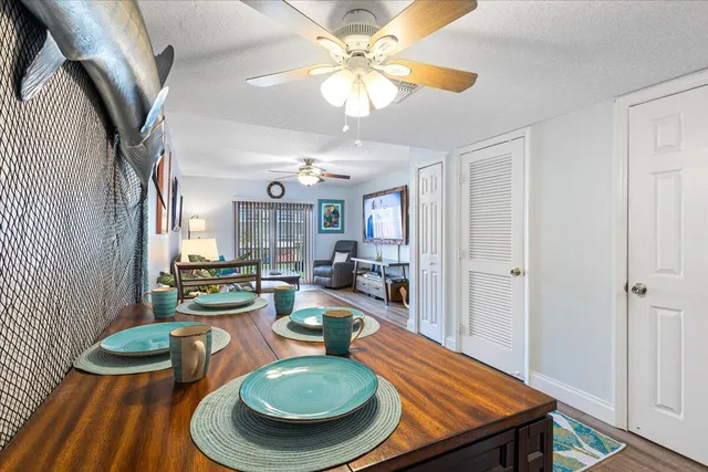 a room with furniture a rug and a chandelier