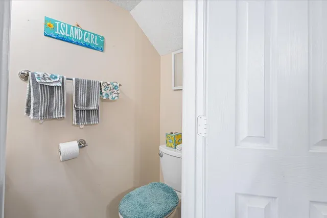 an aerial view of a city with lots of residential buildings lake and ocean view