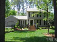 6109 Ivy Ridge Road Raleigh, NC 27612 - Photo 1 of 1 a front view of a house with a yard