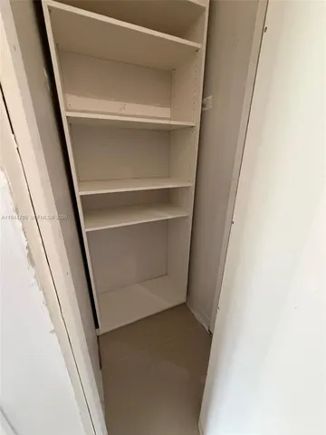 a utility room with sink dryer and washer