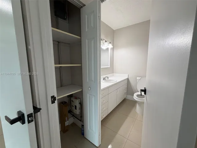 a kitchen with stainless steel appliances granite countertop a stove a refrigerator and a microwave