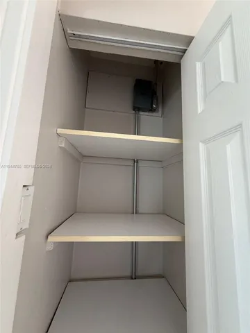 a kitchen with kitchen island a counter top space cabinets and a refrigerator