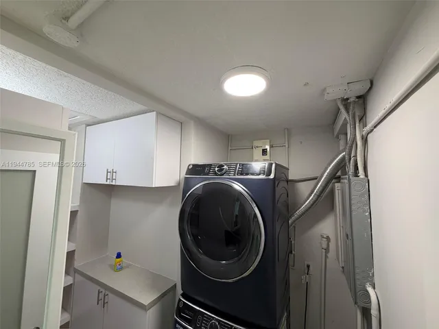 a tree in the backyard of a house