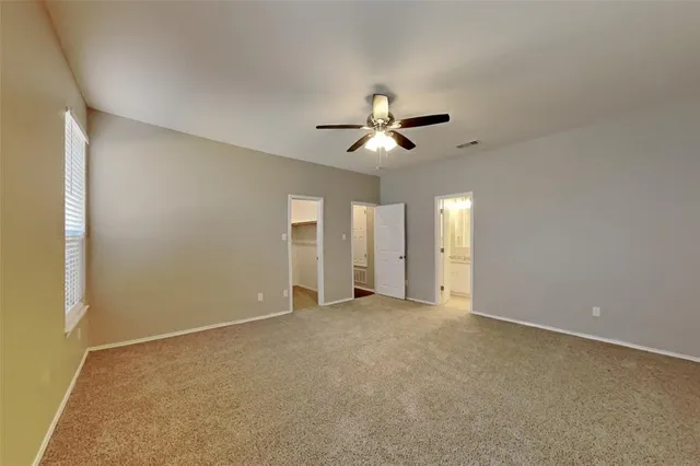 a large kitchen with stainless steel appliances granite countertop a sink and cabinets