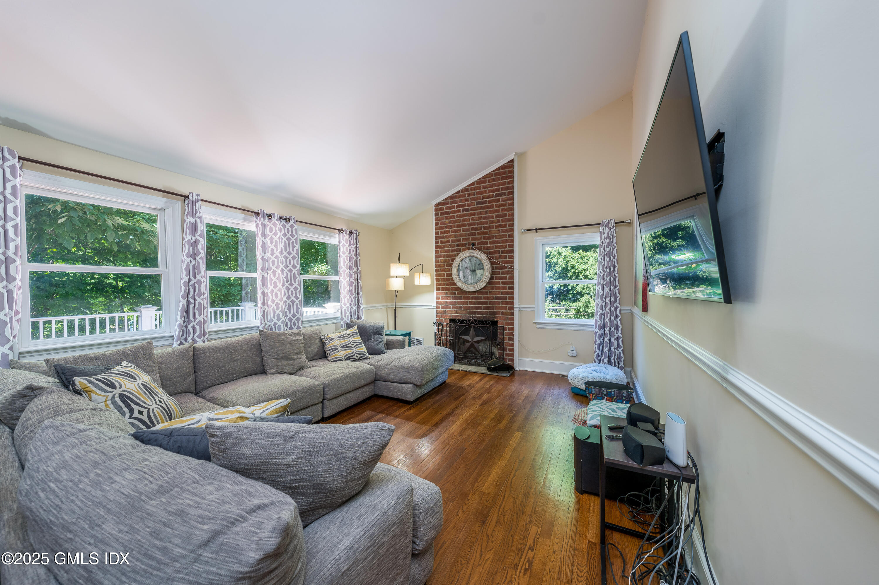 176 Valley Road Cos Cob, CT 06807 - Photo 12 of 27 a living room with furniture and a large window