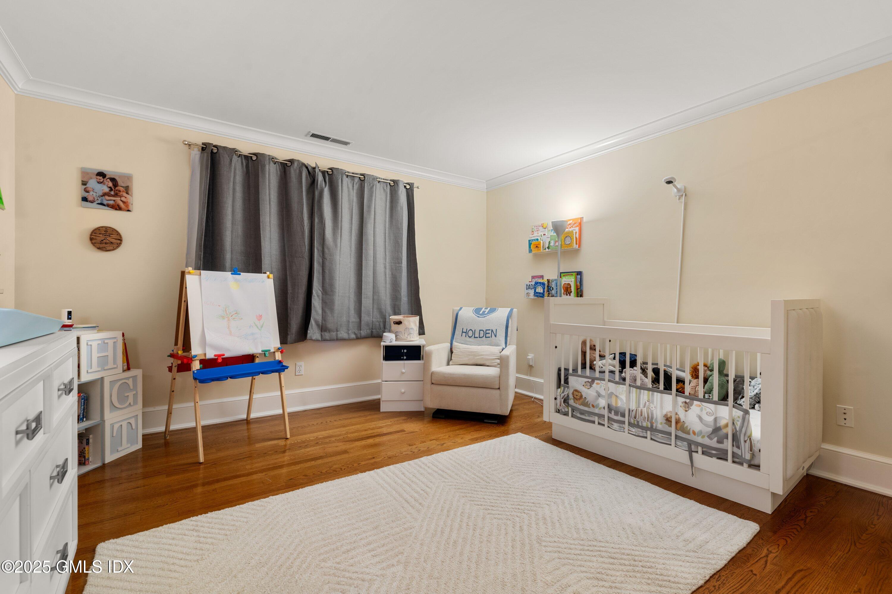 176 Valley Road Cos Cob, CT 06807 - Photo 24 of 27 a living room with furniture and a flat screen tv