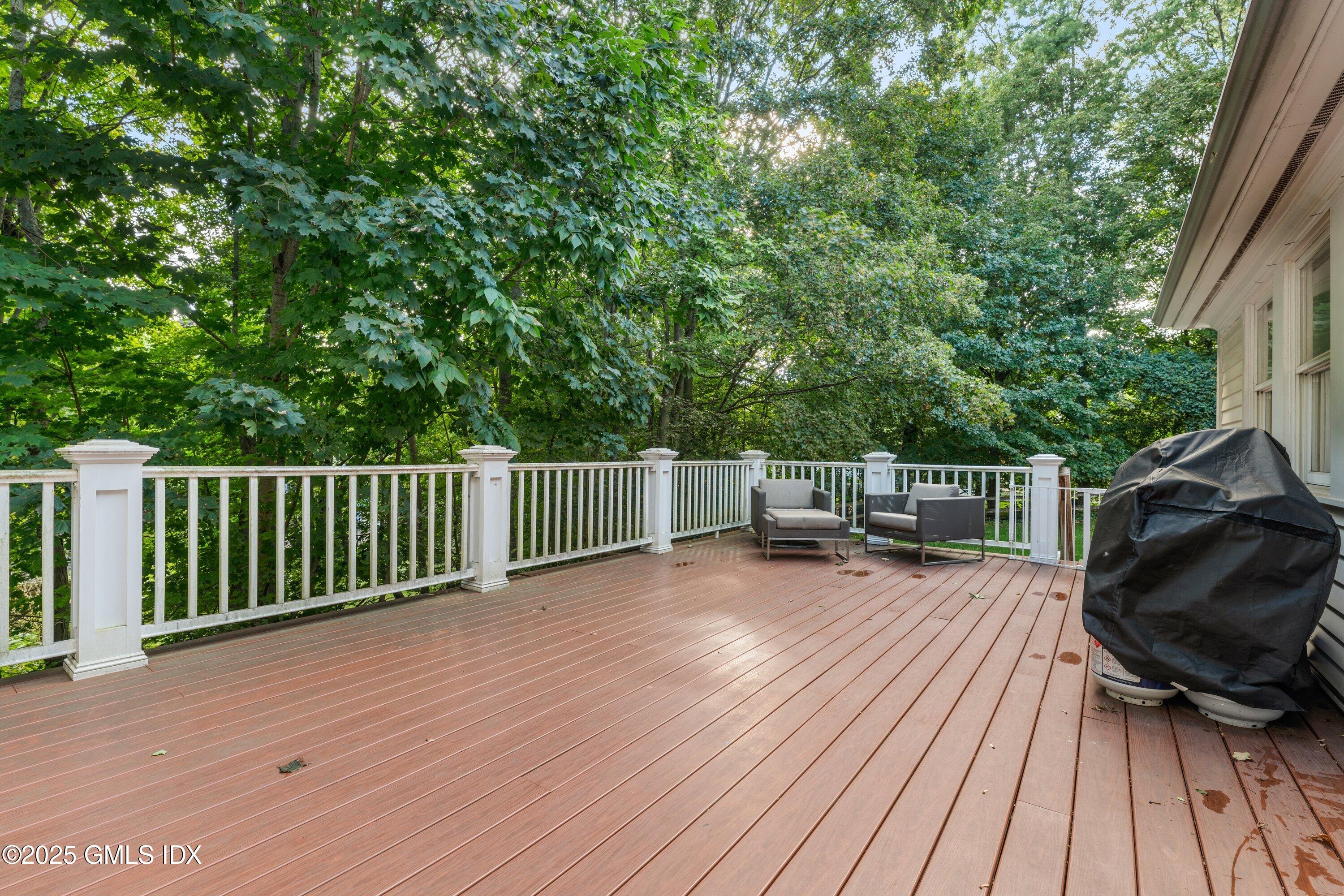 176 Valley Road Cos Cob, CT 06807 - Photo 25 of 27 a view of backyard with deck and outdoor seating