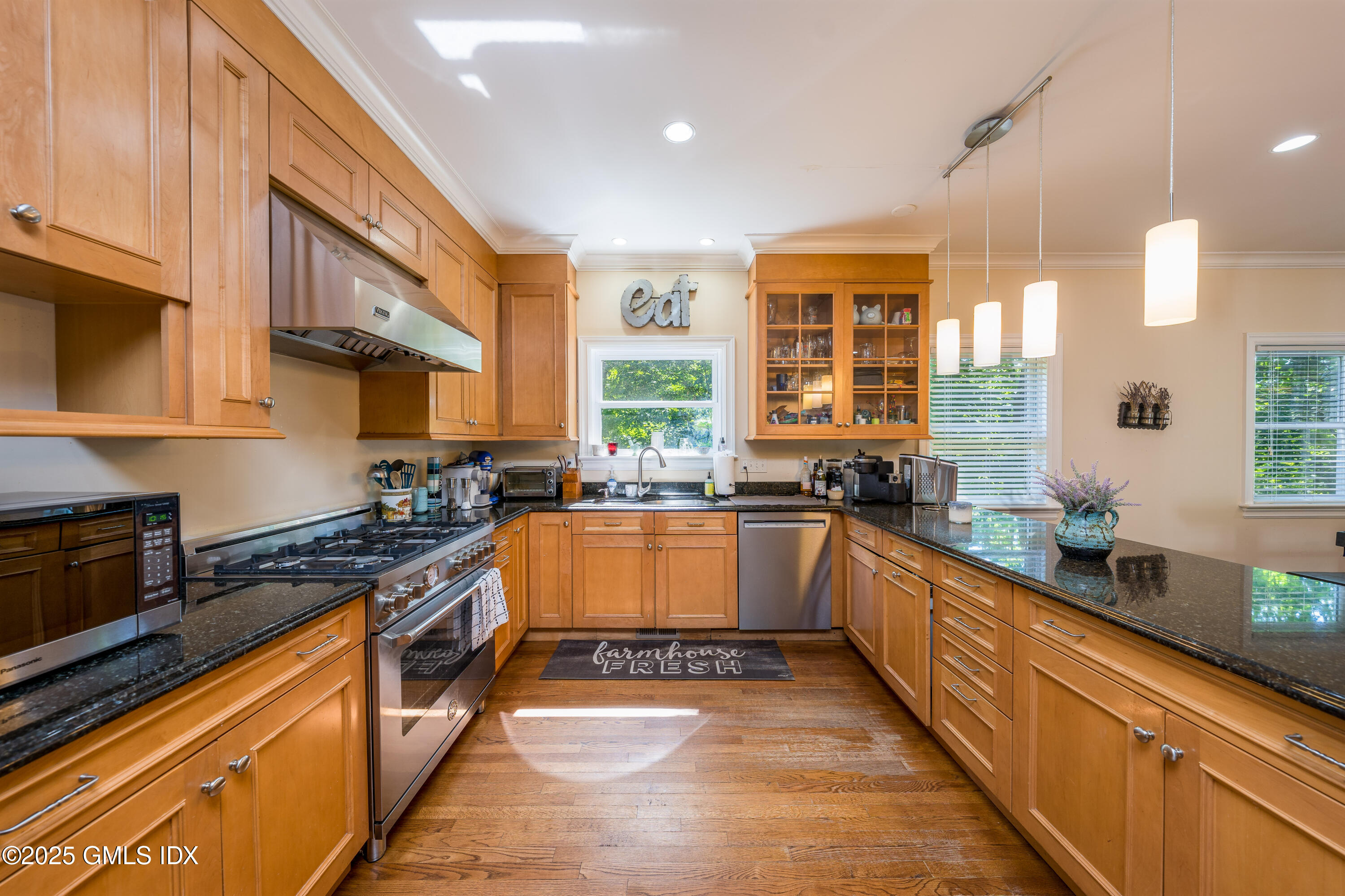 176 Valley Road Cos Cob, CT 06807 - Photo 5 of 27 a large kitchen with stainless steel appliances granite countertop a stove a sink and a granite counter tops
