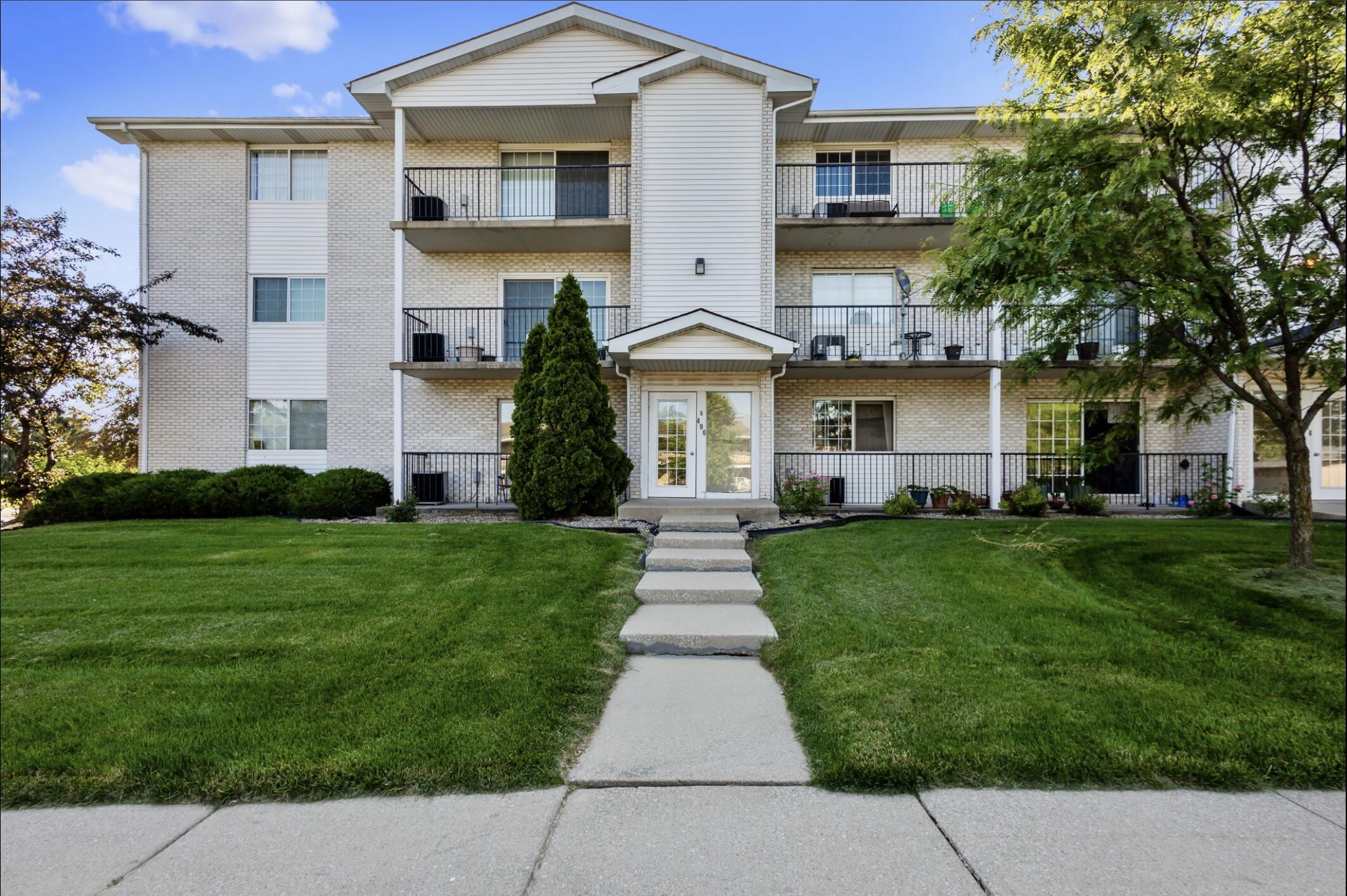 406 Sturdy Road, Unit B6 Valparaiso, IN 46383 - Photo 1 of 10 a front view of a house with a garden and plants