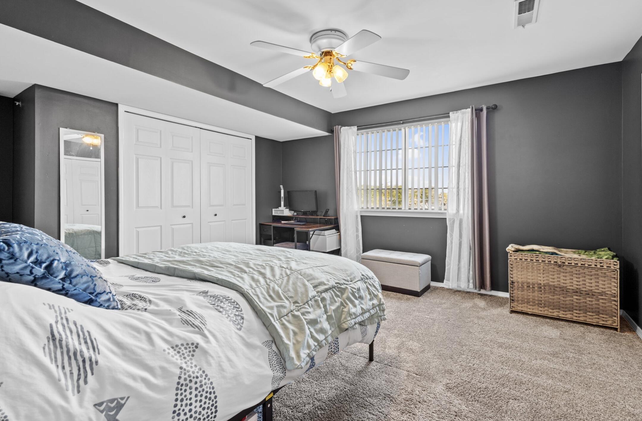 406 Sturdy Road, Unit B6 Valparaiso, IN 46383 - Photo 7 of 10 a spacious bedroom with a bed and a couch