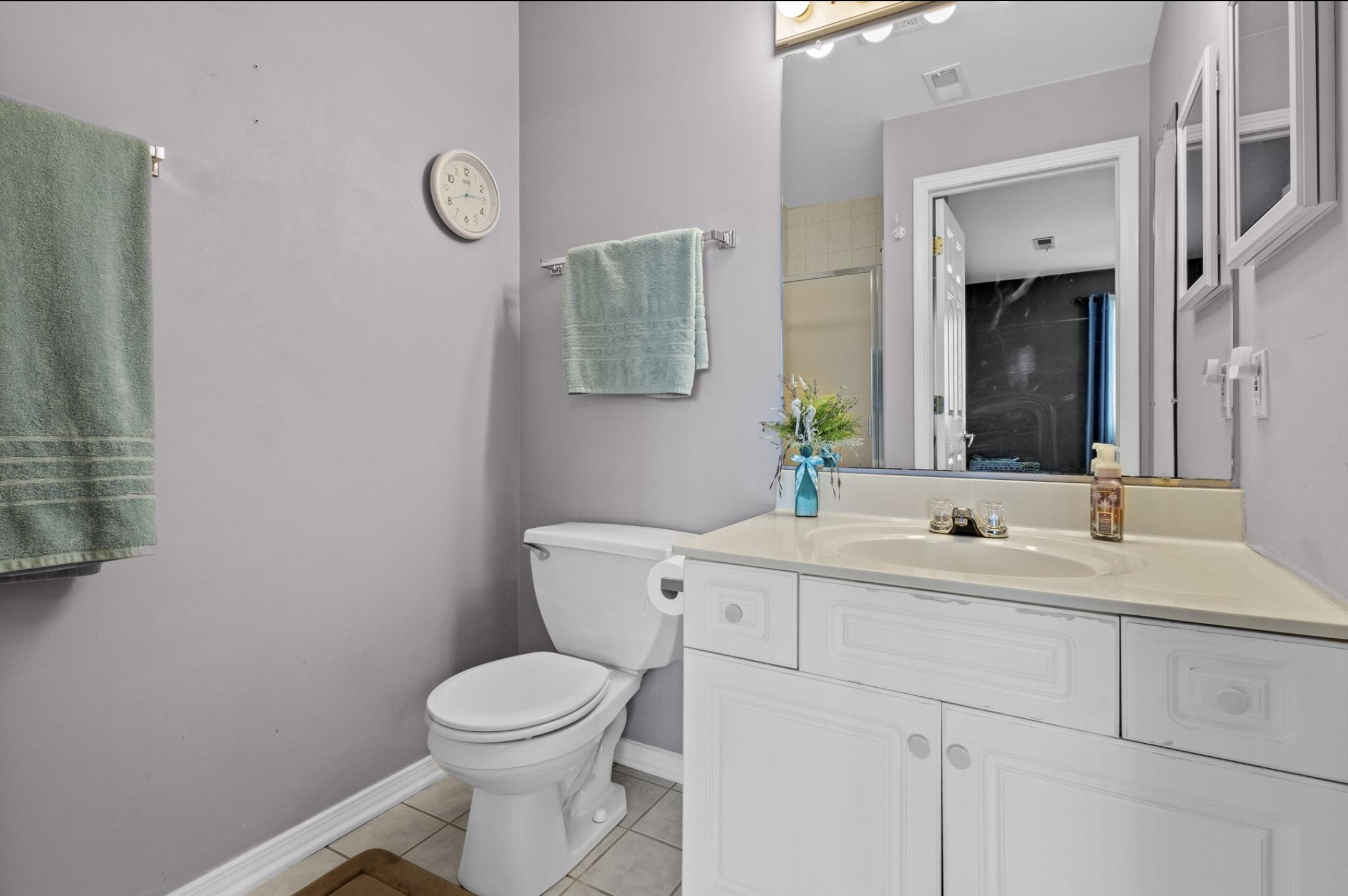406 Sturdy Road, Unit B6 Valparaiso, IN 46383 - Photo 8 of 10 a bathroom with a toilet a sink and mirror