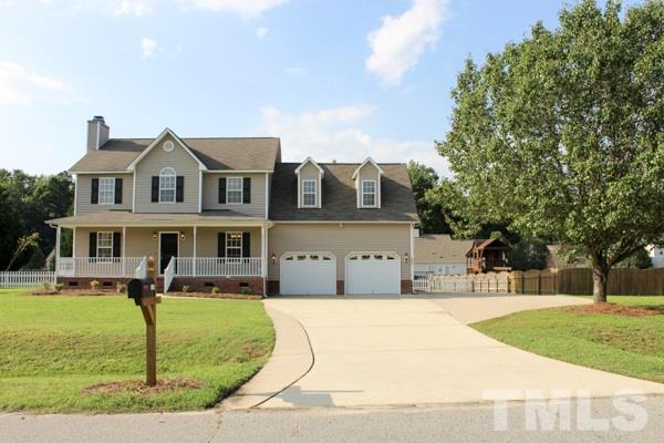1504 Harvey Johnson Road Raleigh, NC 27603 - Photo 1 of 22 a view of a house with a swimming pool