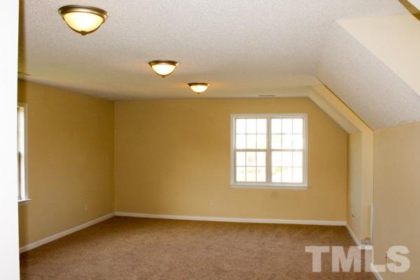 1504 Harvey Johnson Road Raleigh, NC 27603 - Photo 13 of 22 an empty room with windows
