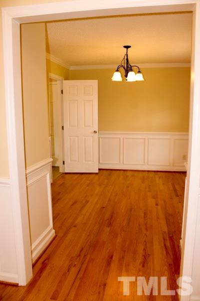 1504 Harvey Johnson Road Raleigh, NC 27603 - Photo 15 of 22 a view of a room with wooden floor and a window