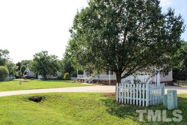 1504 Harvey Johnson Road Raleigh, NC 27603 - Photo 20 of 22 a view of a house with a yard
