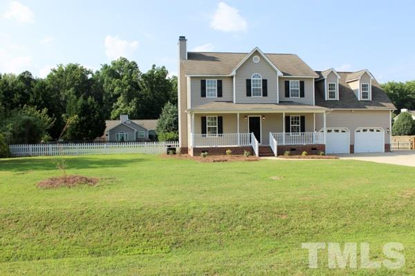 1504 Harvey Johnson Road Raleigh, NC 27603 - Photo 4 of 22 a view of a house with a swimming pool
