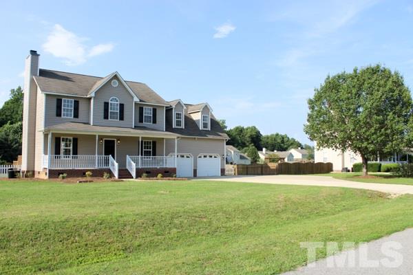 1504 Harvey Johnson Road Raleigh, NC 27603 - Photo 5 of 22 a big house with a big yard and more windows