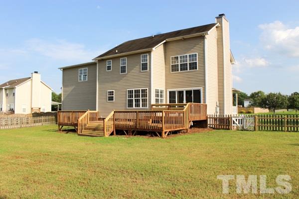 1504 Harvey Johnson Road Raleigh, NC 27603 - Photo 10 of 22 a front view of a house with garden