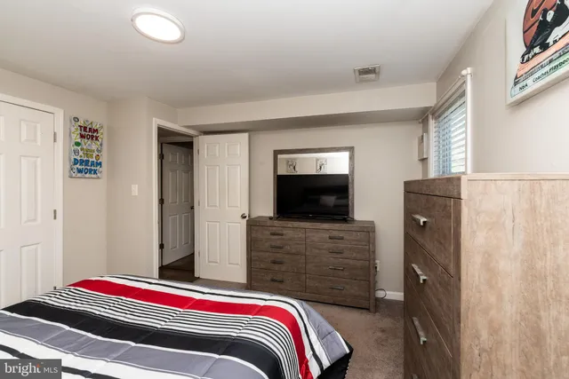 a bedroom with a bed and furniture