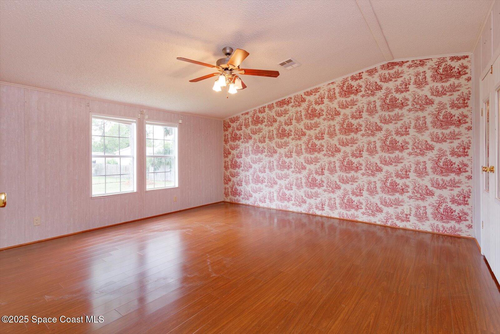 616 Camp Road Cocoa, FL 32927 - Photo 14 of 25 wooden floor in an empty room with a window