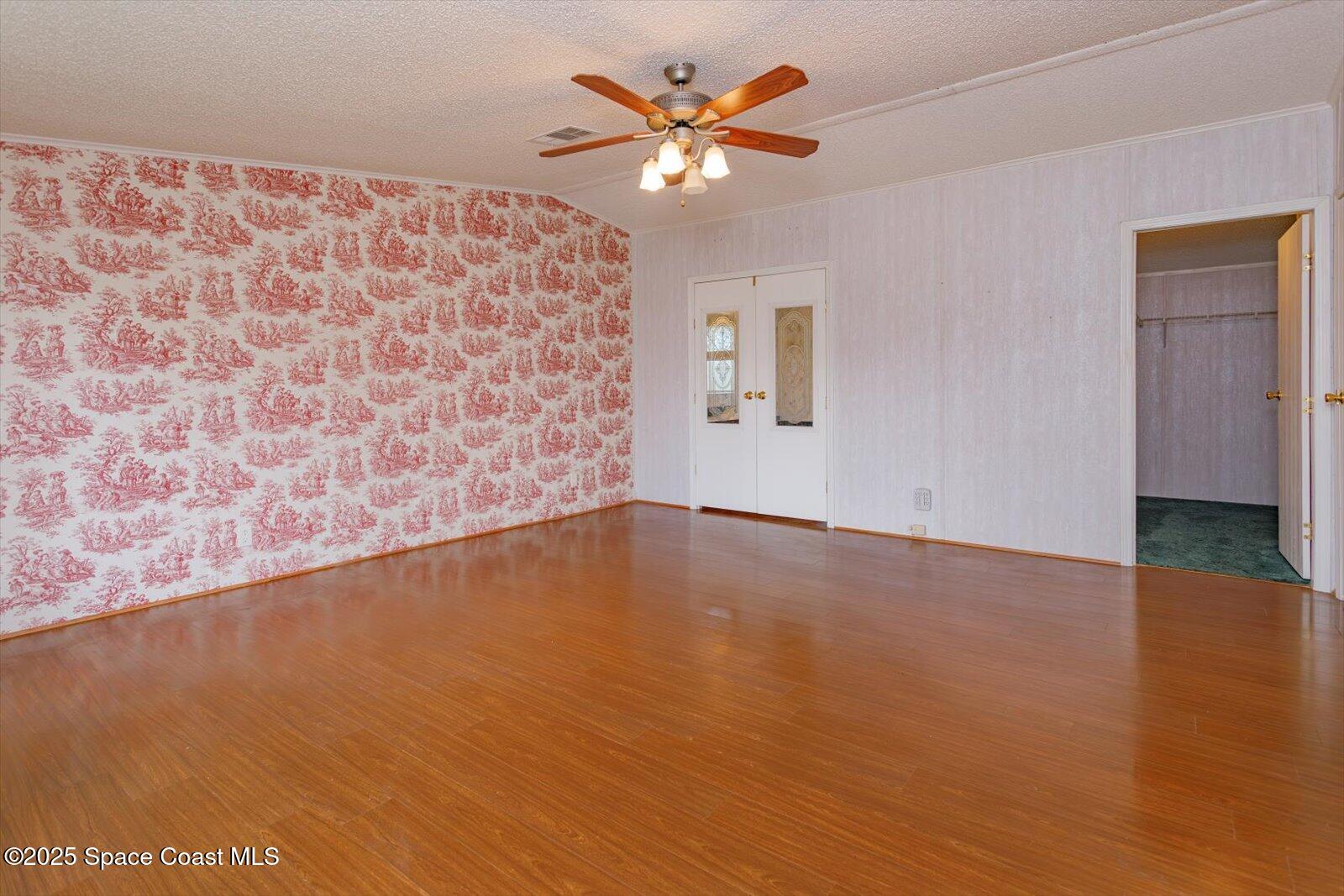 616 Camp Road Cocoa, FL 32927 - Photo 15 of 25 wooden floor in an empty room with a window