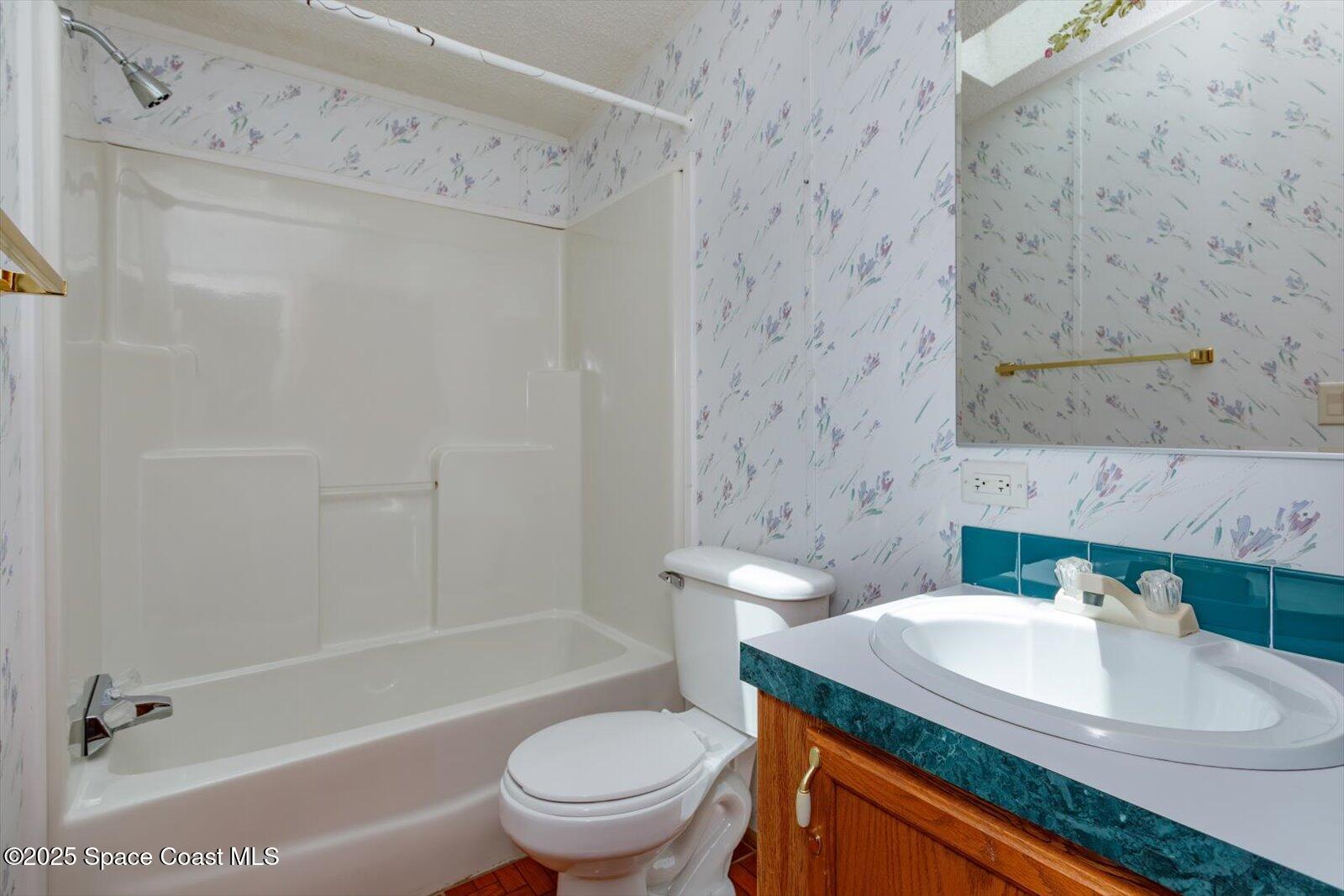 616 Camp Road Cocoa, FL 32927 - Photo 18 of 25 a bathroom with a sink toilet and shower