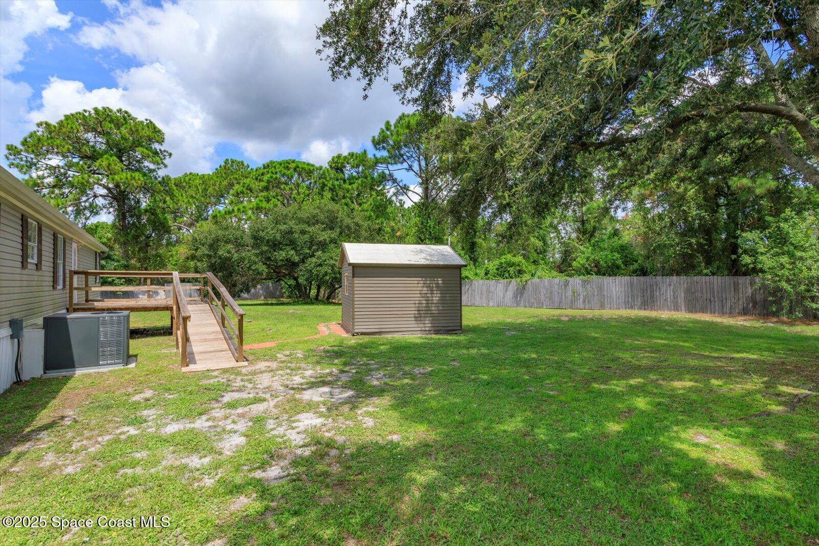 616 Camp Road Cocoa, FL 32927 - Photo 22 of 25 a view of a backyard with large trees