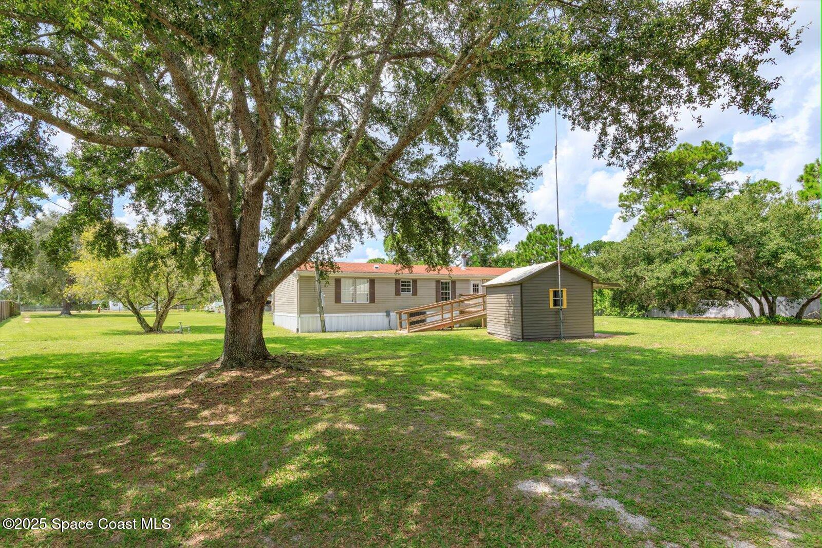 616 Camp Road Cocoa, FL 32927 - Photo 24 of 25 a view of a house with a yard