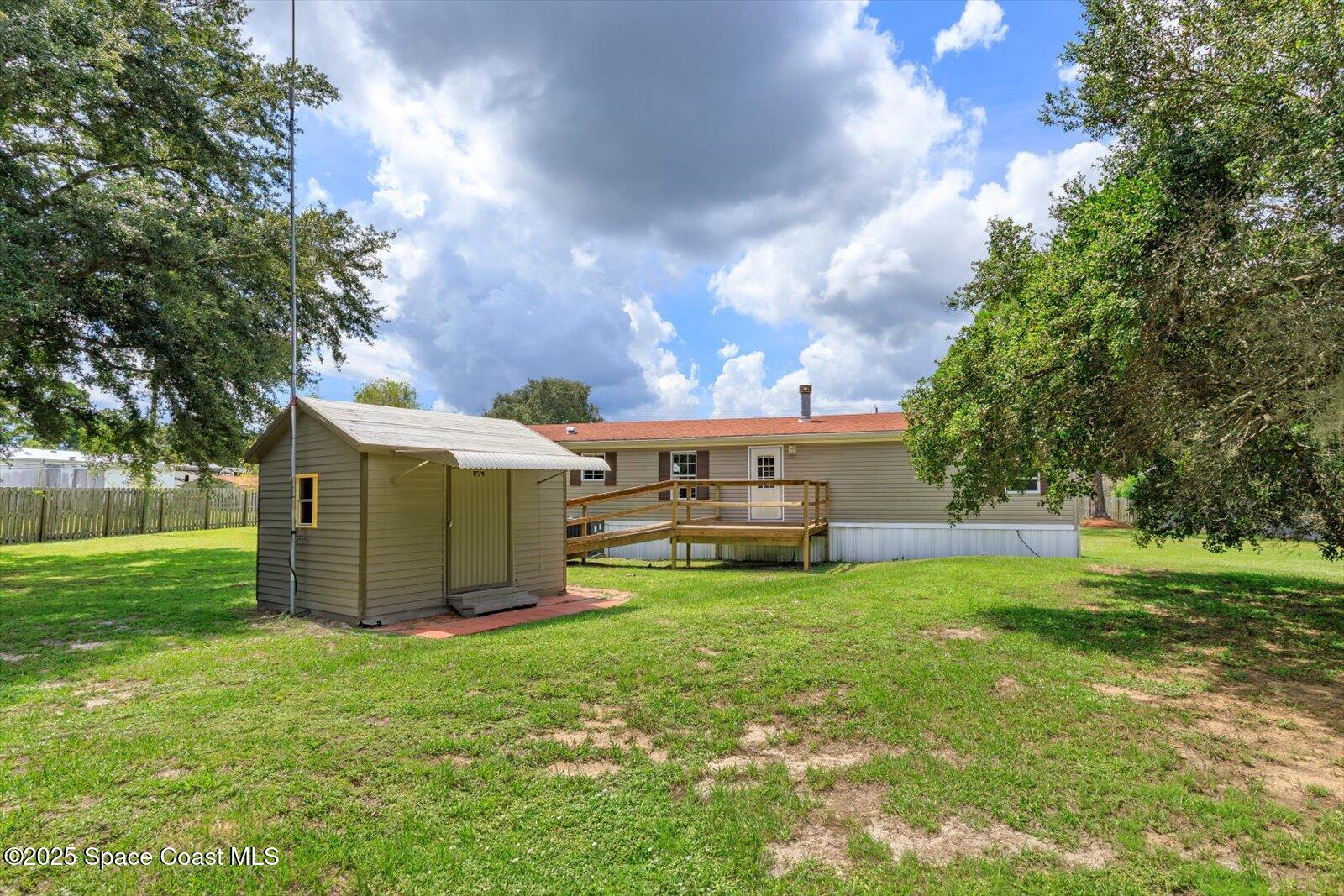 616 Camp Road Cocoa, FL 32927 - Photo 25 of 25 a view of a house with backyard and sitting area
