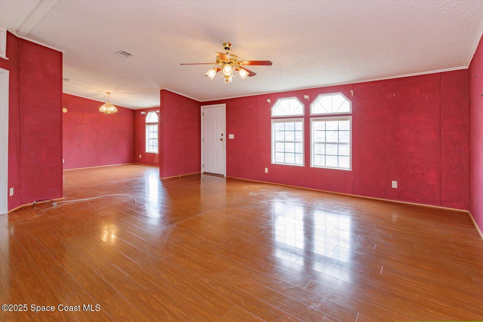 616 Camp Road Cocoa, FL 32927 - Photo 6 of 25 a view of a livingroom with a ceiling fan and window