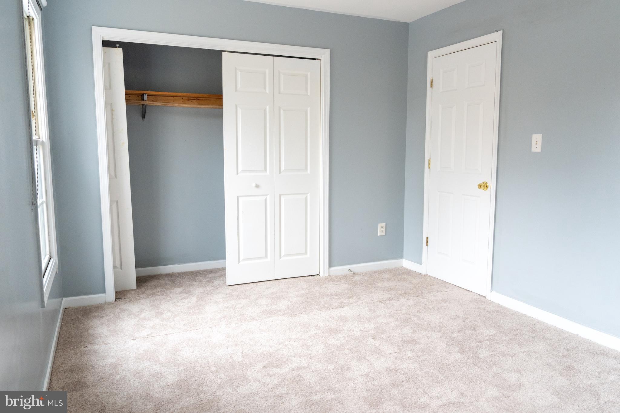 3731 Greenmount Avenue Baltimore, MD 21218 - Photo 14 of 23 an empty room with closet and a bathroom