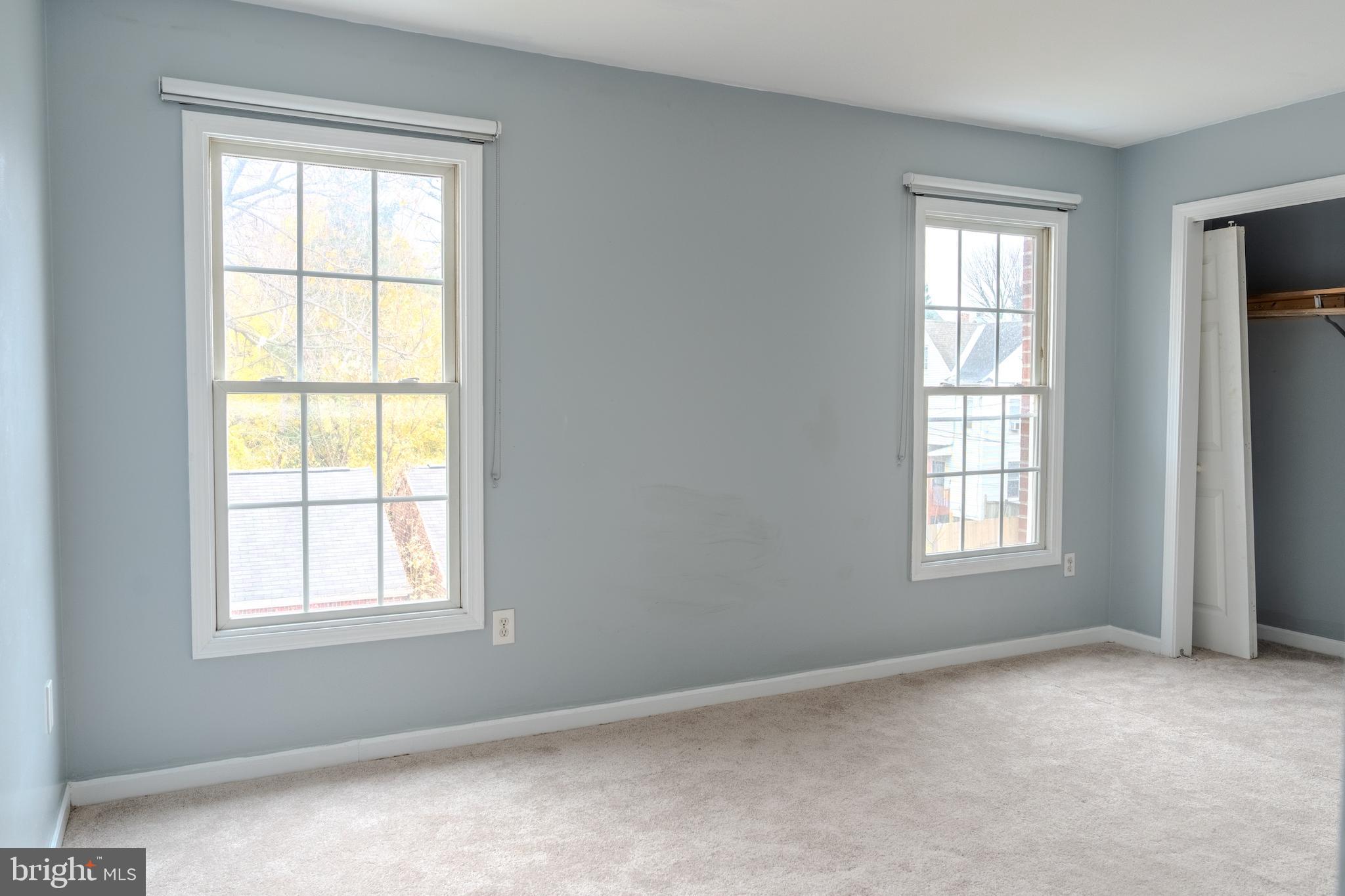 3731 Greenmount Avenue Baltimore, MD 21218 - Photo 15 of 23 a view of an empty room with windows