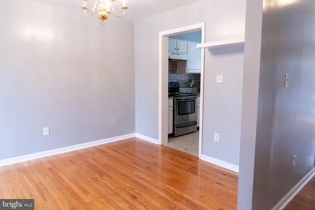 a view of a kitchen with a sink and a refrigerator