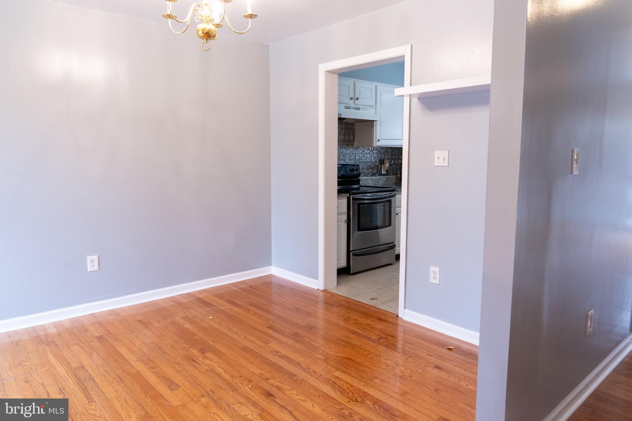 3731 Greenmount Avenue Baltimore, MD 21218 - Photo 5 of 23 a view of a kitchen with a sink and a refrigerator