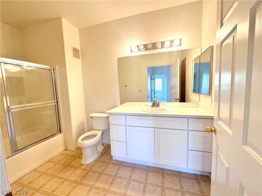 9580 West Reno Avenue, Unit 242 Las Vegas, NV 89148 - Photo 13 of 26 A well-appointed bathroom offers a convenient shower, modern vanity, and reflective surfaces.