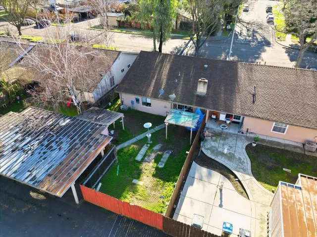 an aerial view of house with yard