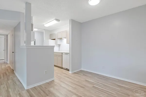a view of a kitchen with wooden floor