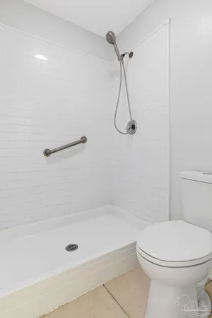 a bathroom with a shower and a toilet