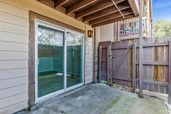 a view of a hallway with wooden walls