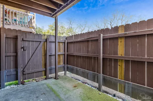 a view of a hallway with wooden walls