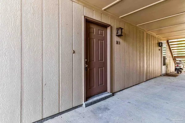 a view of house with outdoor space and parking
